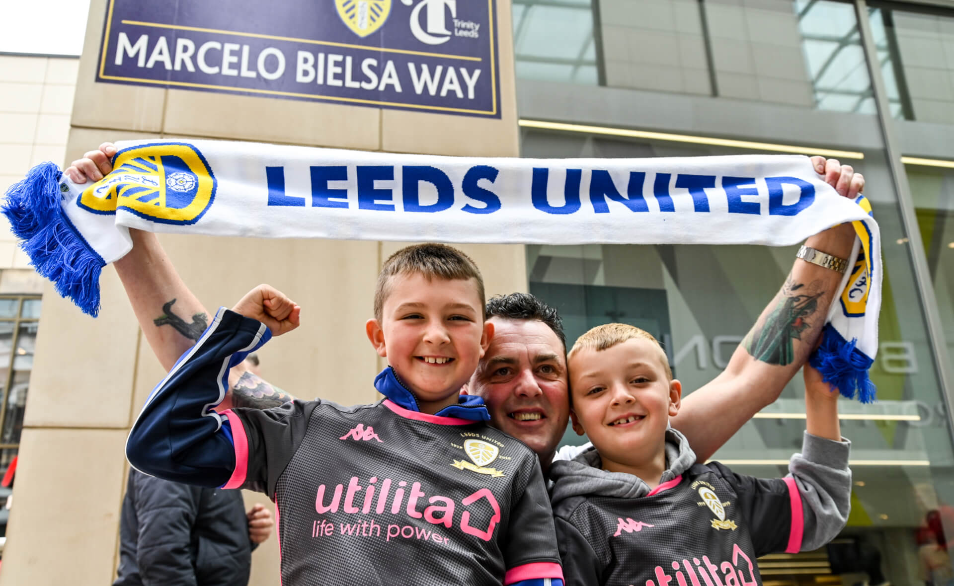 Fans under Trinity Leeds Marcelo Bielsa Way street sign - PR Stunt of the Year