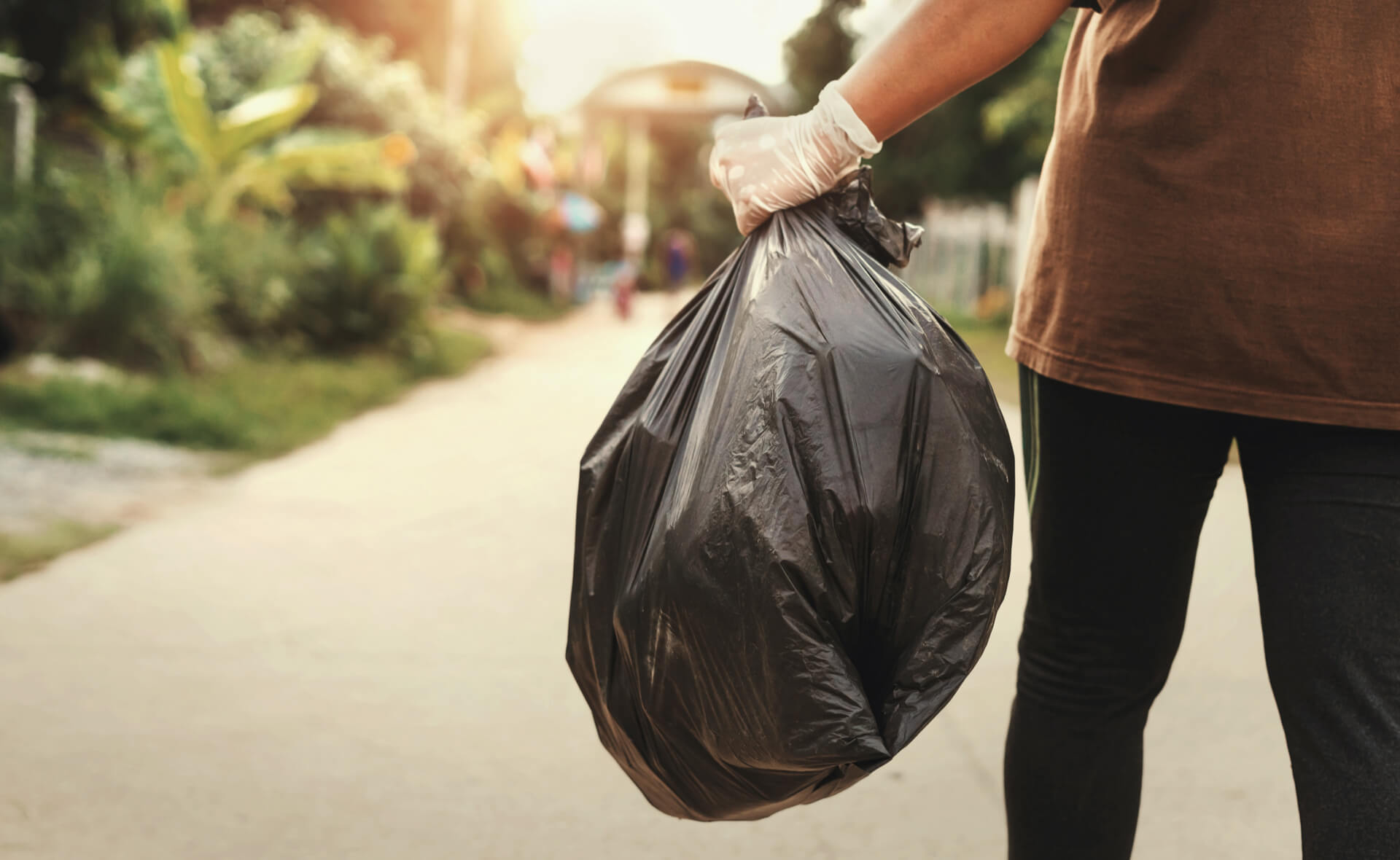 Person putting out rubbish