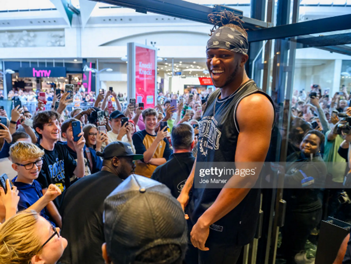 Youtuber and rapper, KSI overlooks a excited crowd during the opening of the Sidemen clothing store in Bluewater, Kent 
