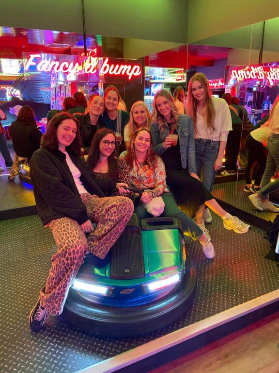 Team Umpf pose around a classic fair-ground bumper car. 