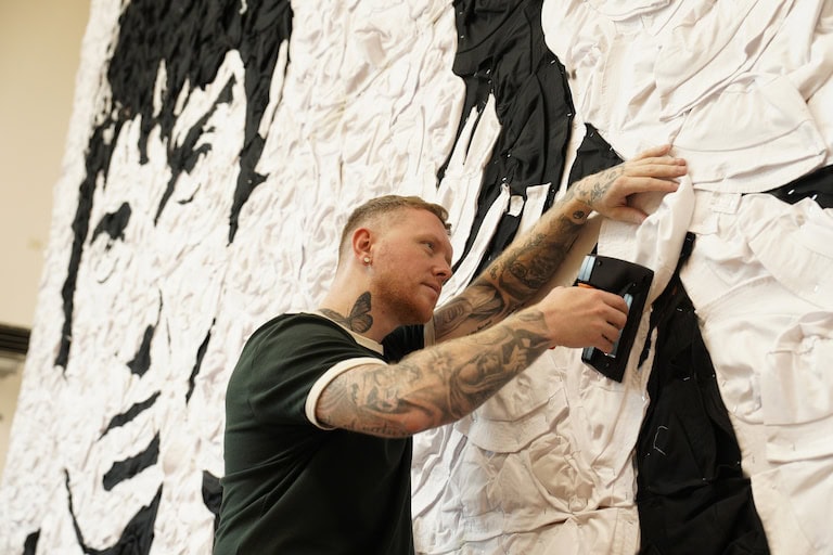 Oasis-Bucket-Hat-Portrait-PR-Stunt-St-Davids-Cardiff-stapler